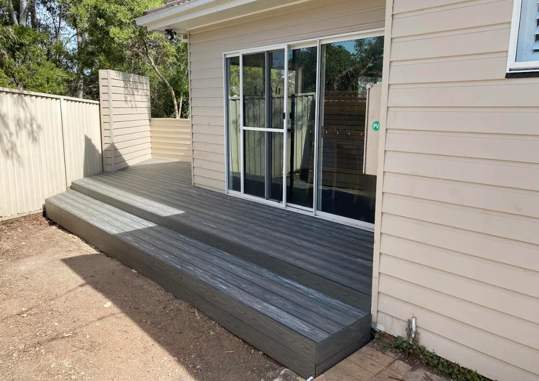 Finished outdoor living area connecting a deck to the house