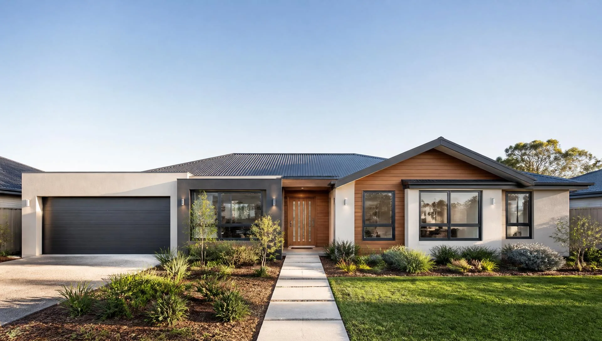 Renovated Sydney home facade with new render, roofing and landscaping after extension works