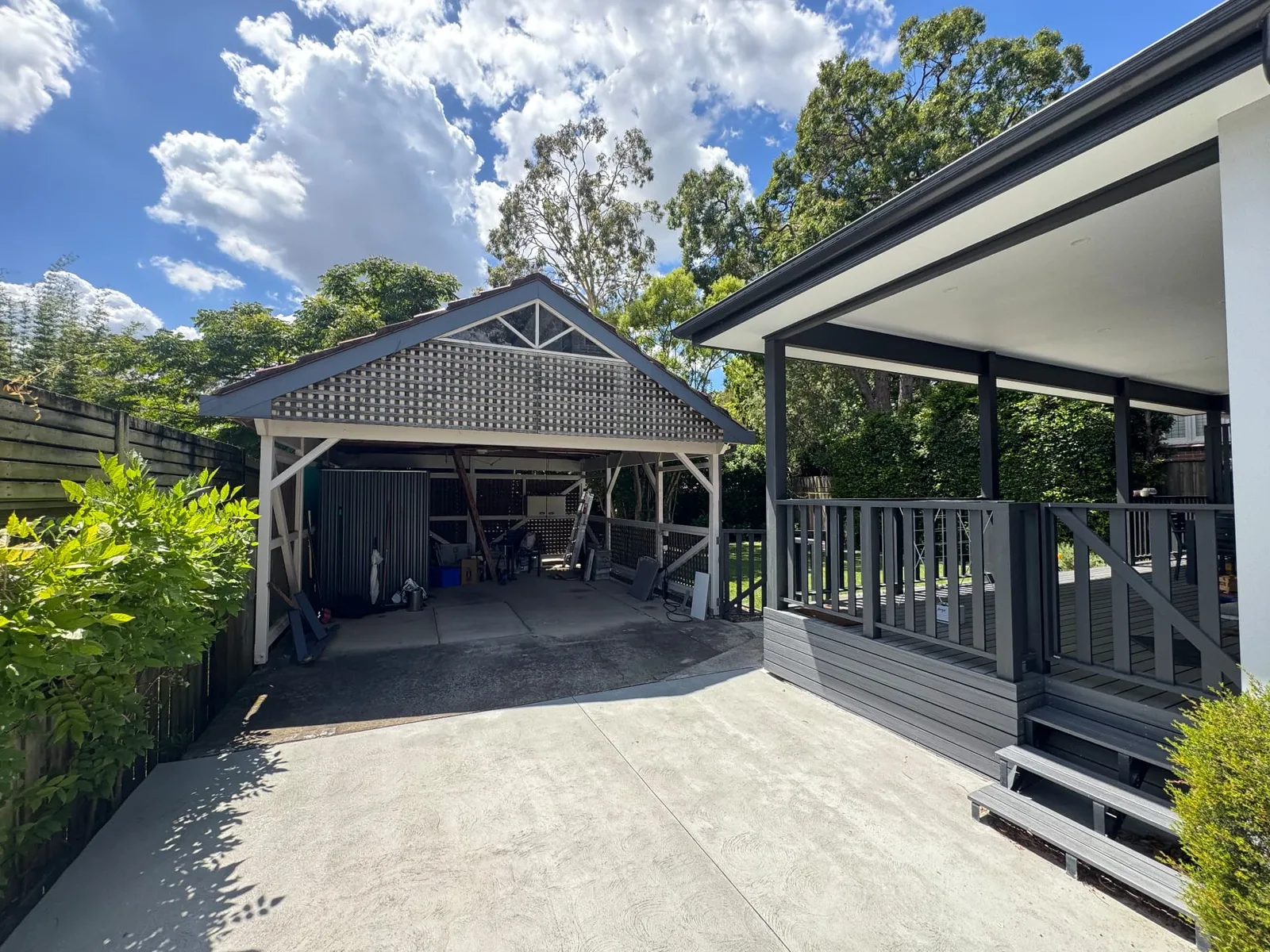The carport and driveway before the repaint and slat panel replacement